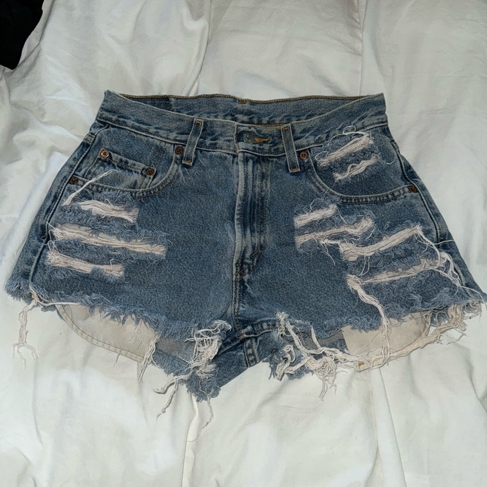 distressed Levi’s denim shorts